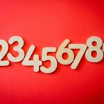 Creative display of numbers one to nine on a vibrant red background, ideal for educational materials.